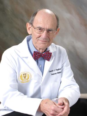 Dr. Baylink in white coat and bowtie